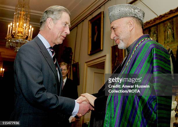 Prince Charles, Prince of Wales shakes hands with President Hamid Karzai of Afghanistan at Clarence House in London on Feb. 14, 2007.