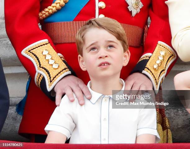 Prince George of Cambridge watches a flypast from the balcony of Buckingham Palace during Trooping The Colour, the Queen's annual birthday parade, on...