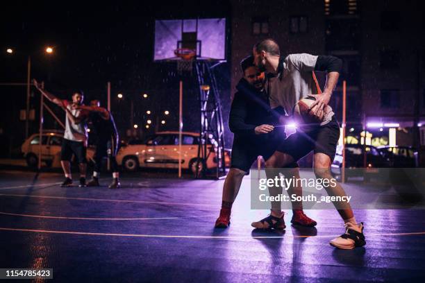 purple lights and basketball - streetball stock pictures, royalty-free photos & images