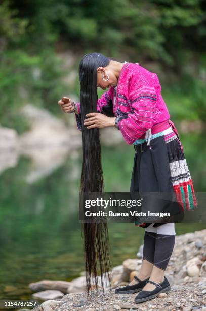 yao ethnic minority woman with typical long hair. - yao tribe stock pictures, royalty-free photos & images