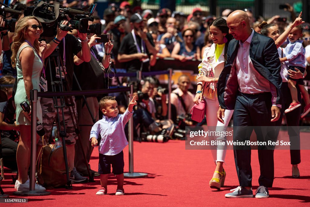 Manager Alex Cora of the Boston Red Sox walks the red carpet during