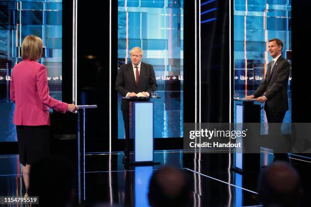 In this handout image provided by ITV, Host Julie Etchingham, Boris Johnson and Jeremy Hunt take part in the Jeremy Hunt and Boris Johnson debate...