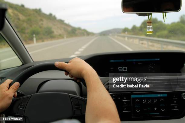 man driving car - luchtverfrisser stockfoto's en -beelden