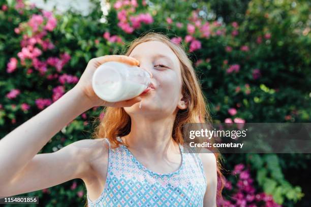 drinking milk - kid drinking milk stock pictures, royalty-free photos & images