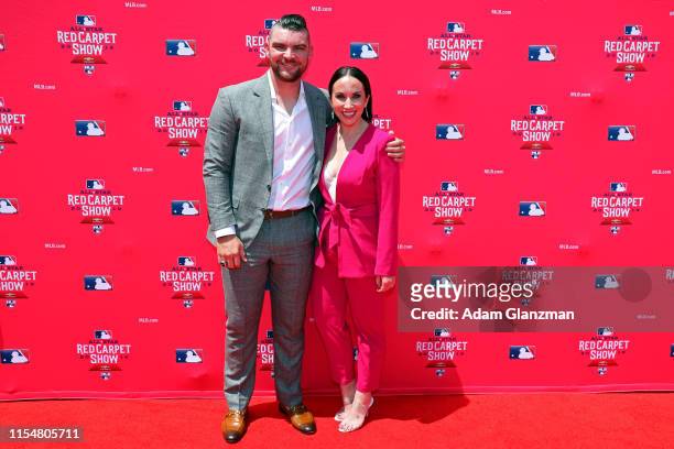 Liam Hendriks of the Oakland Athletics poses for a photo with his wife Kristi Hendriks during the MLB Red Carpet Show presented by Chevrolet at...