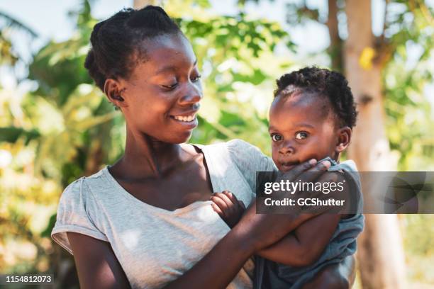 african mother and daughter - starving woman stock pictures, royalty-free photos & images