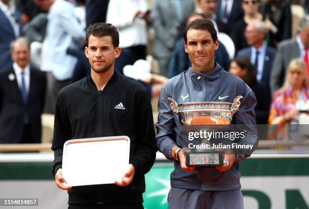 Winner, Rafael Nadal of Spain stands next to runner up Dominic Thiem of Austria with their trophies following their mens singles final during Day...