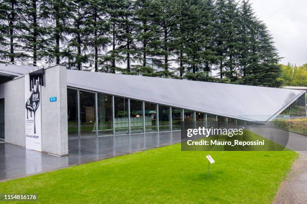 view of the 21_21 design sight museum designed by japanese architect tadao ando in roppongi district at minato ward, tokyo city, japan. - tadao ando stock pictures, royalty-free photos & images