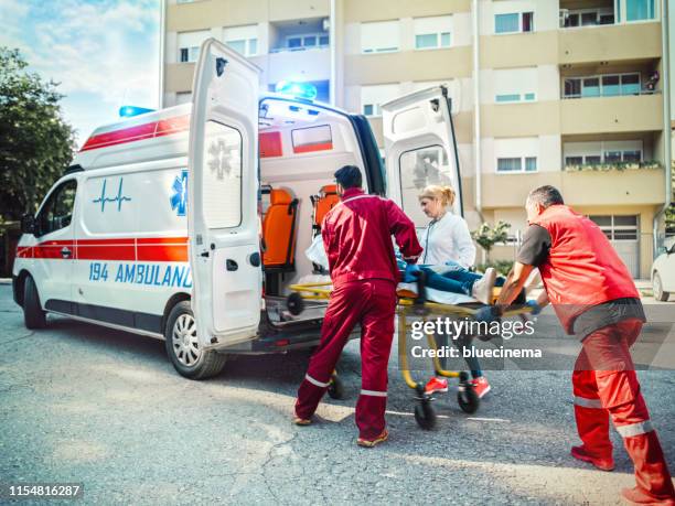 paramedic team pushing stretcher - hospital gurney stock pictures, royalty-free photos & images