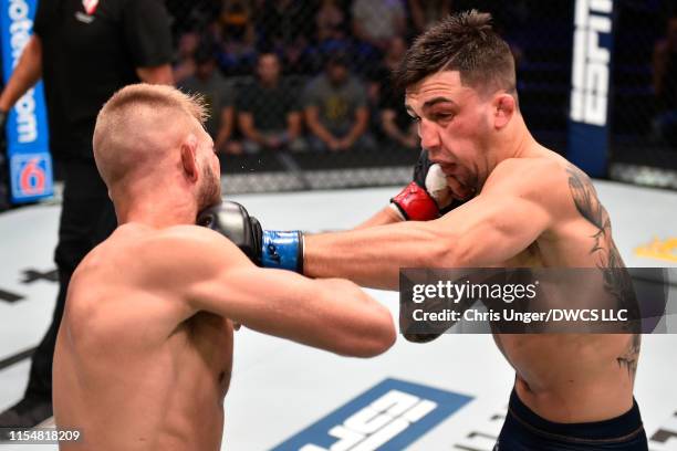 Jacob Rosales and Jonathan Pearce trade punches in their lightweight bout during Dana White's Contender Series at the UFC Apex on July 9, 2019 in Las...