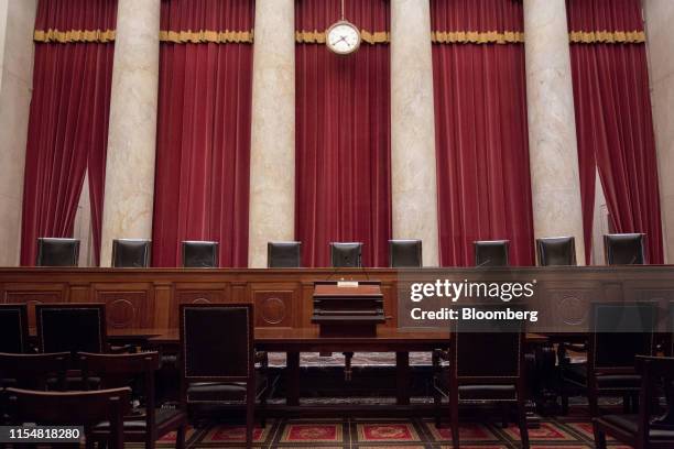 Chairs of U.S. Supreme Court justices sit behind the courtroom bench in Washington, D.C., U.S., on Tuesday, July 9, 2019. At the end of its term, the...