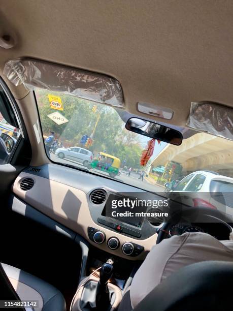 image of street view of nehru place, delhi, india, seen through taxi windcreen, cab interior - delhi stock pictures, royalty-free photos & images
