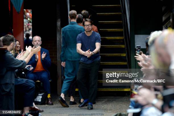 Fashion designer Oliver Spencer on the runway at the finale of his show during London Fashion Week Men's June 2019 on June 09, 2019 in London,...
