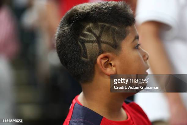Detail shot of a Yankees logo in the haircut of a young fan during the 90th MLB All-Star Game at Progressive Field on Tuesday, July 9, 2019 in...