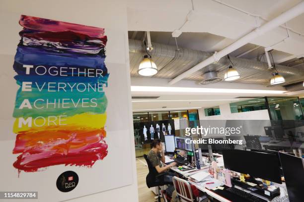 Sign is displayed on a wall inside the Li & Fung Ltd. Offices in Hong Kong, China, on Friday, July 5, 2019. Li & Fung, the world's...