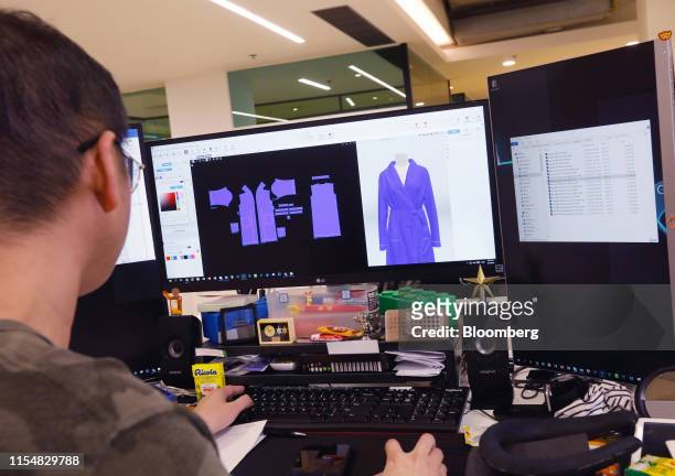 An employee works on a 3D graphic rendering of a garment design at the Li & Fung Ltd. Offices in Hong Kong, China, on Friday, July 5, 2019. Li &...