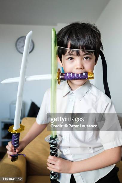 boy playing as ninja - ninja kid stock pictures, royalty-free photos & images