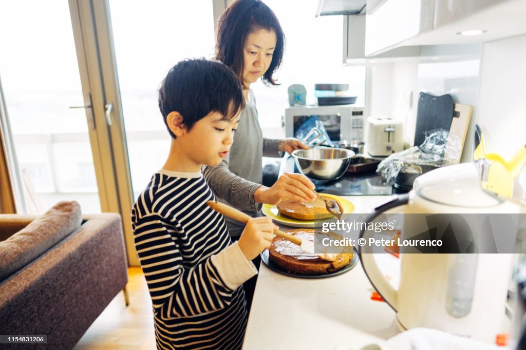 Mother and son baking cake