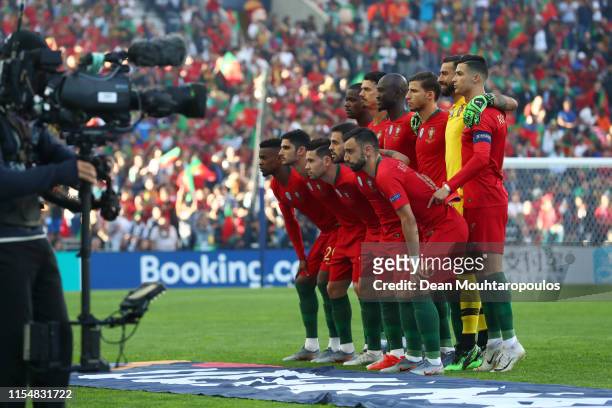 Cristiano Ronaldo of Portugal stands on his tip toes as players of Portugal pose for a team photograph prior to the UEFA Nations League Final between...