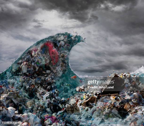 tidal wave of garbage and pollution - plastikmüll stock-fotos und bilder
