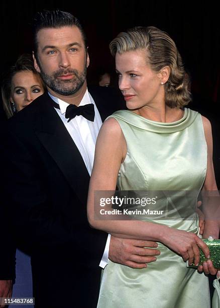 Alec Baldwin and Kim Basinger during The 70th Annual Academy Awards - Red Carpet at Shrine Auditorium in Los Angeles, California, United States.