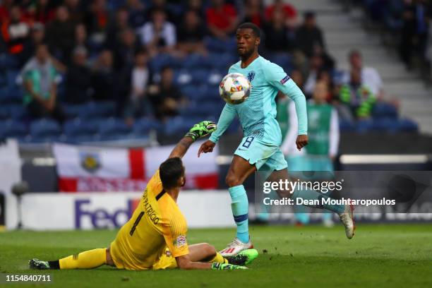 Rui Patricio of Portugal saves from Georginio Wijnaldum of the Netherlands during the UEFA Nations League Final between Portugal and the Netherlands...