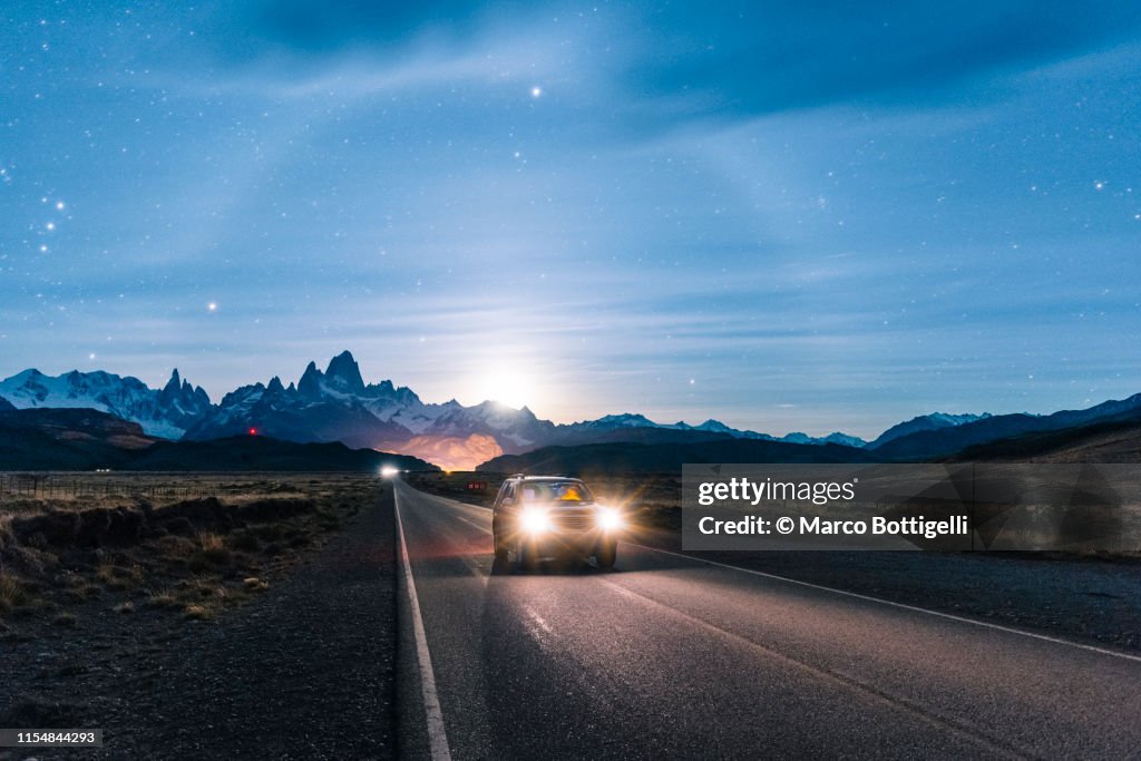 Car driving at night on the road to El Chalten, Patagonia Argentina