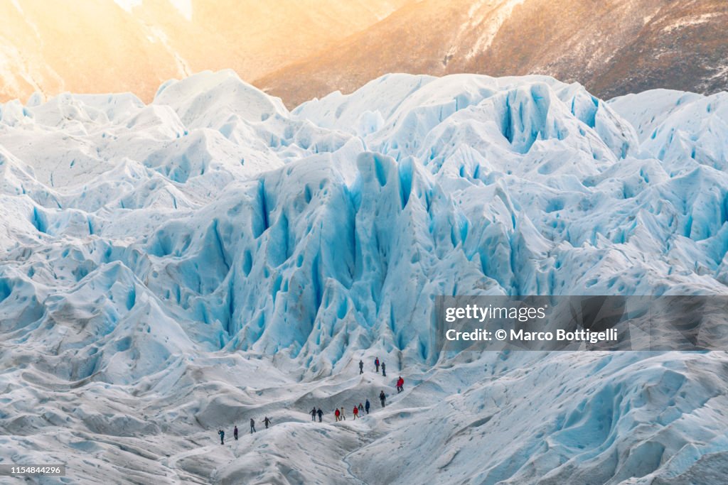 Group of people hiking on the Perito Moreno glacier, Argentina