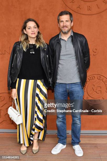 Marion Cotillard and Guillaume Canet attends the 2019 French Tennis Open - Day Fithteen at Roland Garros on June 09, 2019 in Paris, France.