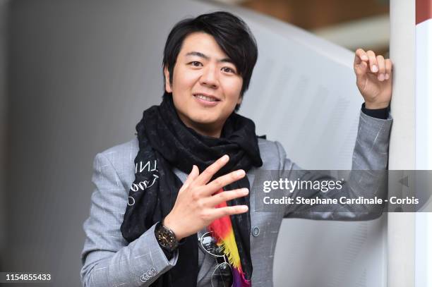 Pianist Lang Lang attends the 2019 French Tennis Open - Day Fithteen at Roland Garros on June 09, 2019 in Paris, France.
