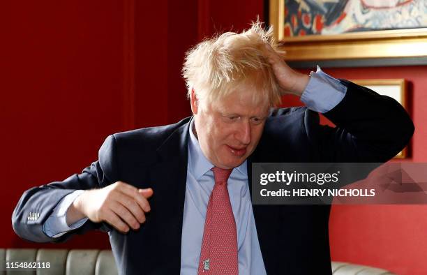 Conservative leadership contender Boris Johnson, reacts during his visit to JD Wetherspoon's Metropolitan Bar in London, on July 10, 2019.