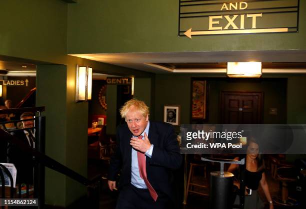 Boris Johnson, a leadership candidate for Britain's Conservative Party visits Wetherspoons Metropolitan Bar to meet with with JD Wetherspoon...