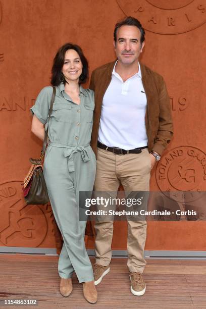 Actor Jean Dujardin and his wife Ice skater Nathalie Pechalat attend the 2019 French Tennis Open - Day Fifteenth at Roland Garros on June 09, 2019 in...