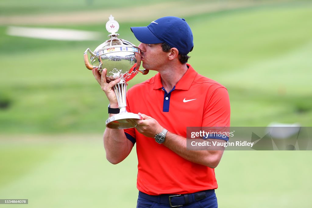 Rory McIlroy of Northern Ireland poses for a photo with the trophy ...