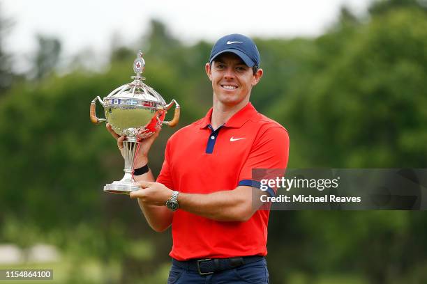 Rory McIlroy of Northern Ireland poses for a photo with the trophy after winning the RBC Canadian Open at Hamilton Golf and Country Club on June 09,...