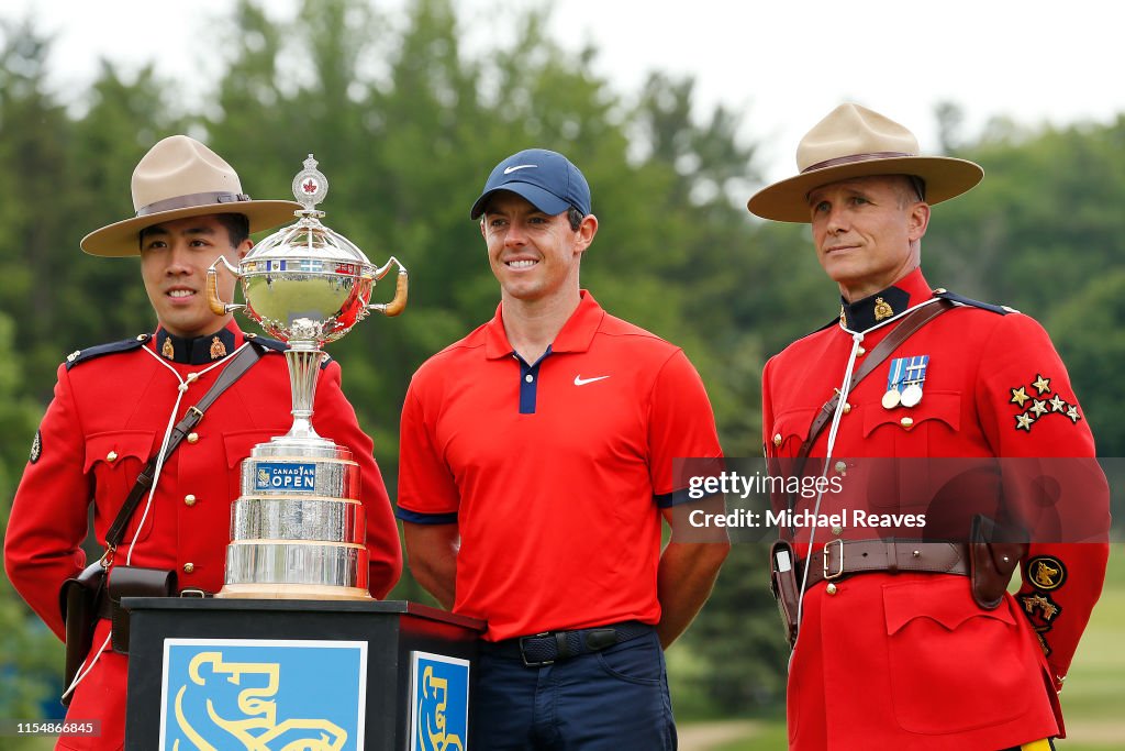 Rory McIlroy of Northern Ireland pose for a photo with two Canadian Rory McIlroy of Northern Ireland pose for a photo with two Canadian