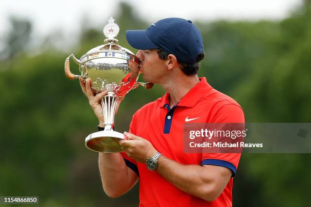 Rory McIlroy of Northern Ireland poses for a photo with the trophy after winning the RBC Canadian Open at Hamilton Golf and Country Club on June 09,...