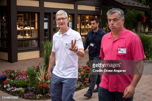 Tim Cook, chief executive officer of Apple, and Eddy Cue, senior vice president of Internet Software and Services at Apple, attend the annual Allen &...