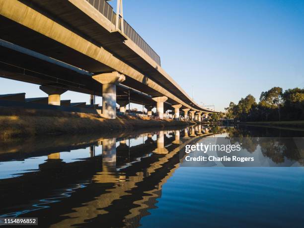 melbourne citylink overpass in kensington and moonee ponds creek reflection - moonee stock pictures, royalty-free photos & images
