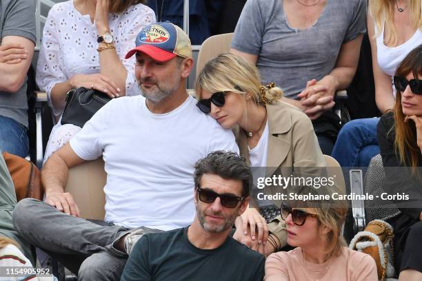 Gilles Lellouche and Alizee Guinochet attend the 2019 French Tennis Open - Day Fifteenth at Roland Garros on June 09, 2019 in Paris, France.