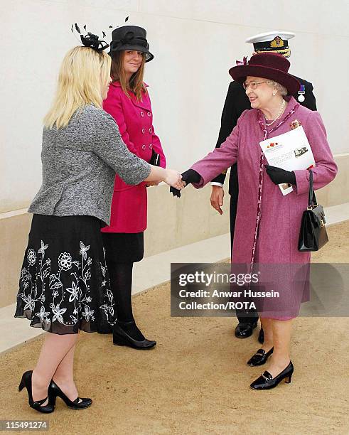 Queen Elizabeth ll meets Tracy Wilson, whose husband Danny Wilson was killed in Iraq, following the dedication ceremony for the new National Armed...