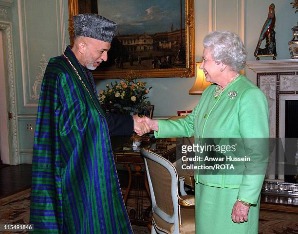 Queen Elizabeth ll receives the President of Afghanistan, Hamid Karzai, in the Private Audience Room at Buckingham Palace on October 24, 2007 in...