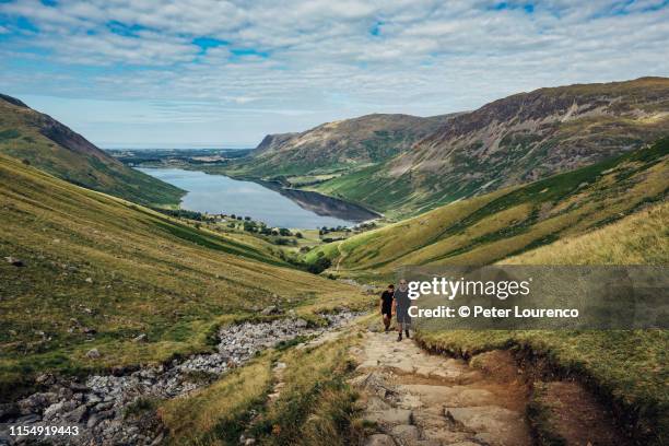 friends hiking - lakeland stock pictures, royalty-free photos & images