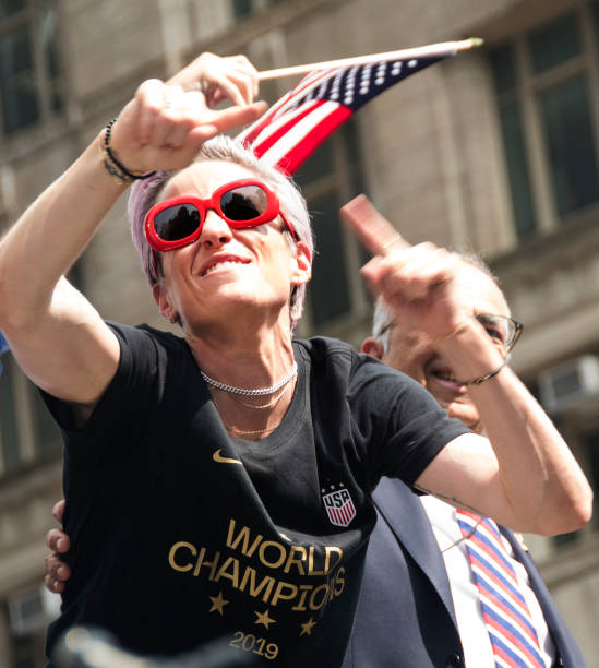 Captain Megan Rapinoe celebrates while riding on a float during The U.S. Women's National Soccer Team Victory Parade and City Hall Ceremony down the...