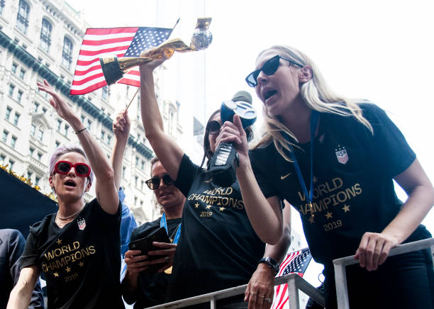 Megan Rapinoe, Ashlyn Harris, Alex Morgan and Allie Long celebrate during a Victory Ticker Tape Parade for the U.S. Women's National Soccer Team down...