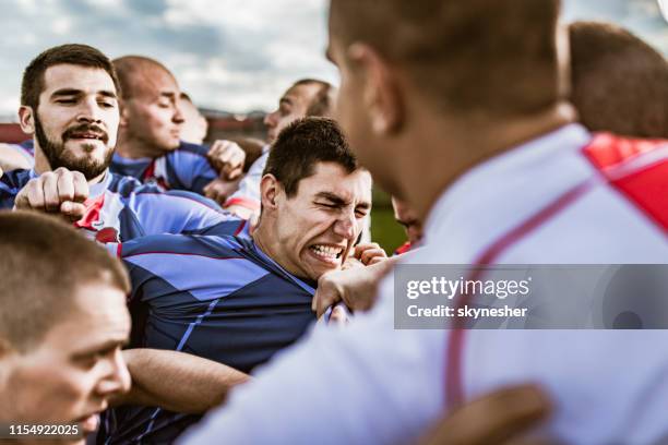 fist fight on sports match! - face off sports play stock pictures, royalty-free photos & images