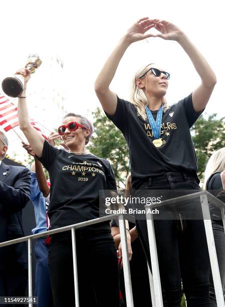 Members Megan Rapinoe and Allie Long are seen during the U.S. Women's National Soccer Team Victory Parade on July 10, 2019 in New York City.