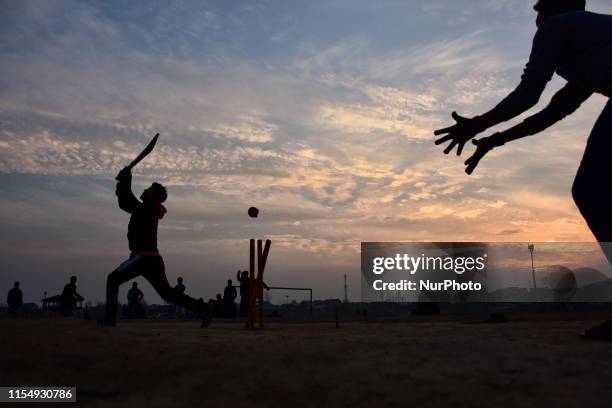 Kashmiri boys play cricket during sunset in Srinagar, Indian Administered Kashmir on 10 July 2019. Cricket is the most played and liked game in...