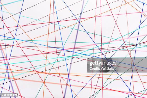 crossing rainbow  color strings - string stock pictures, royalty-free photos & images