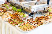 Fresh mediterranean canapes with fresh vegetable salads and baked products.